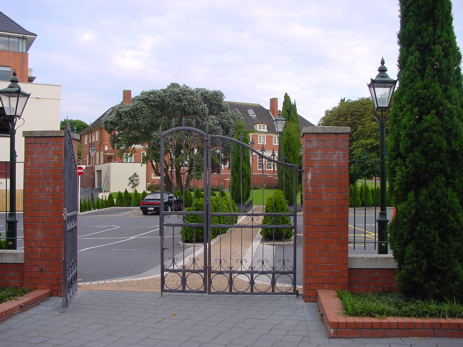 Estate entrance with brick gate and formal drive